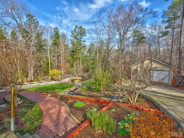 14412 Possum Track Road Raleigh, NC 27614 - Photo 24 of 25 a view of a yard with plants and trees