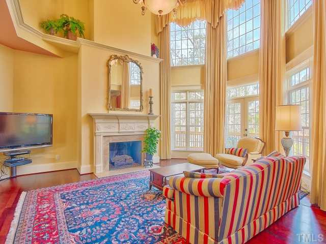 14412 Possum Track Road Raleigh, NC 27614 - Photo 8 of 25 a living room with a balcony furniture and a fireplace