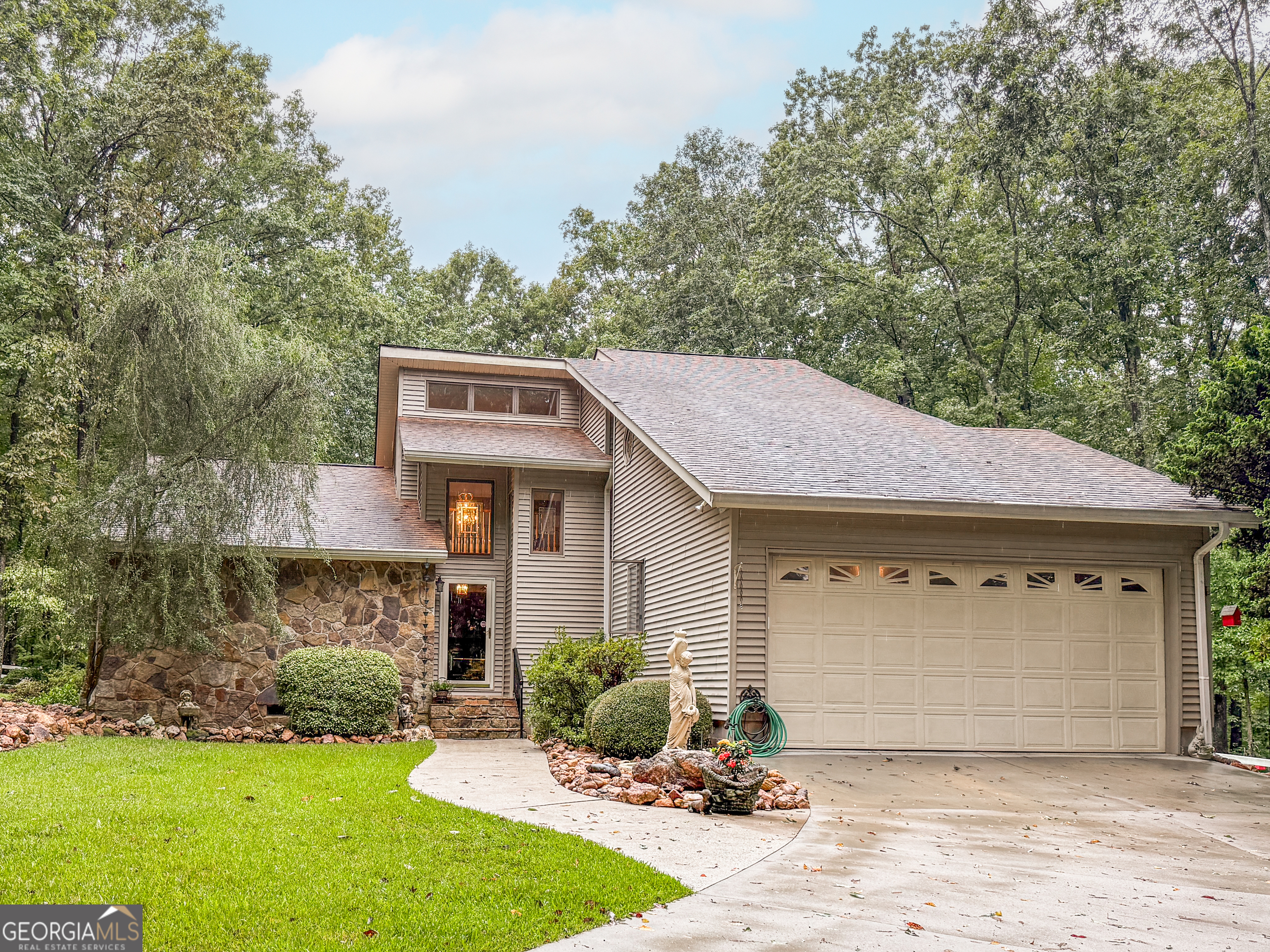2088 Gresham Road Zebulon, GA 30295 - Photo 1 of 1 a front view of a house with a yard and garage