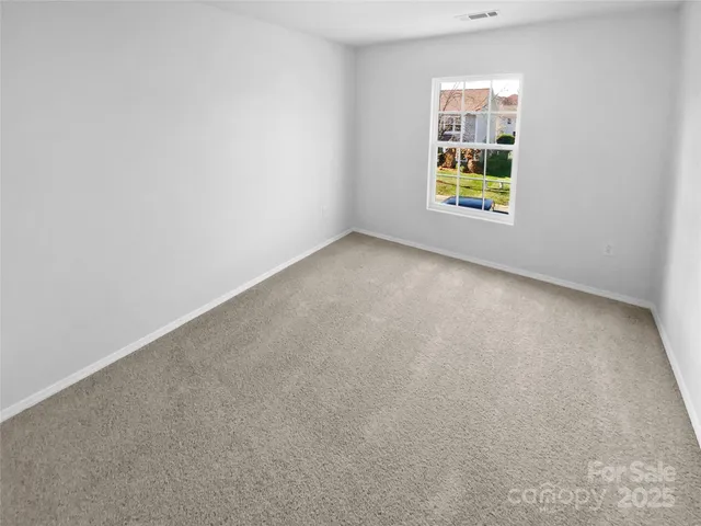 a view of a white wall and closet in a room
