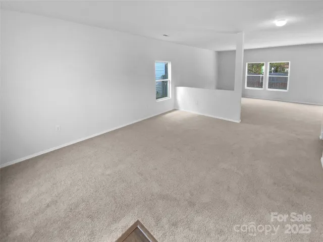 a view of empty room with windows