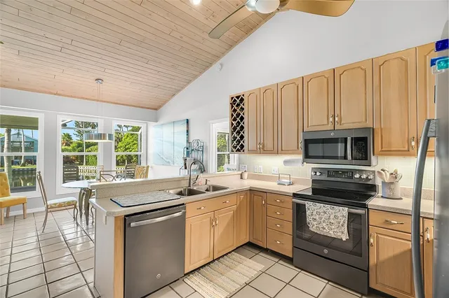 a kitchen with a sink stove and microwave