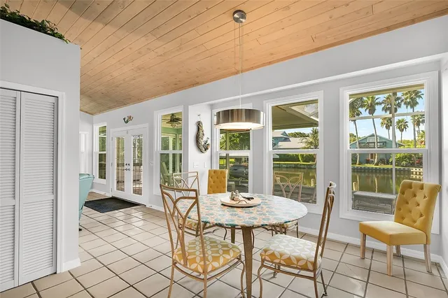 a view of a patio with a dining table and chairs
