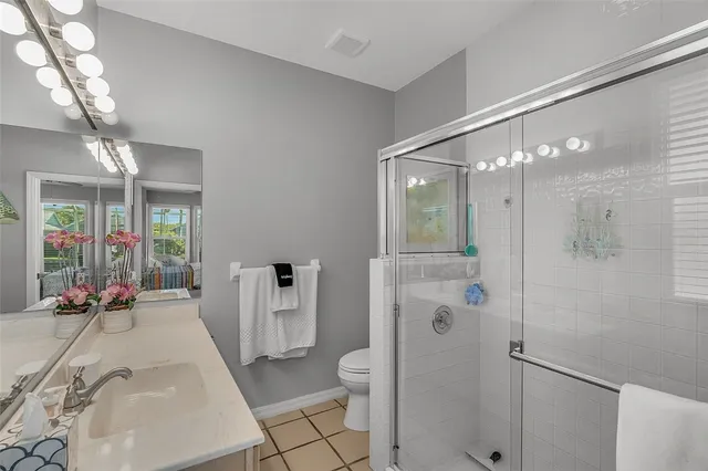 a spacious bathroom with a shower and a sink