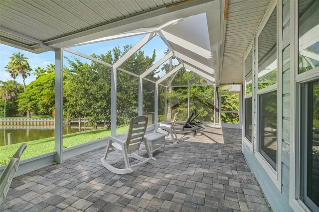 a view of a porch with chairs and floor