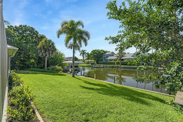 a view of a lake with a house in the background