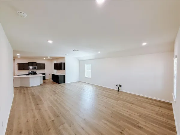 a view of a kitchen with microwave and cabinets