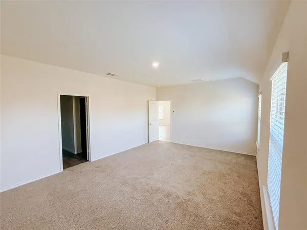 a view of an empty room and window