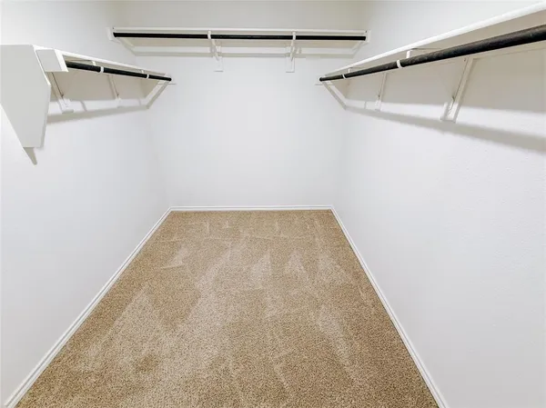 a view of a room with racks on the wall