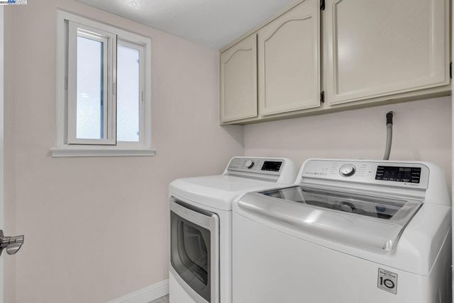 a bedroom with bed and wooden floor