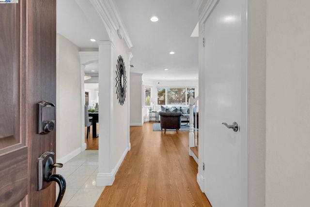 a living room with fireplace furniture and a flat screen tv