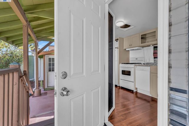 a view of a hallway with washer and dryer