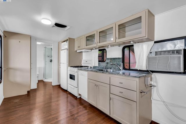 a view of a kitchen with washer and dryer