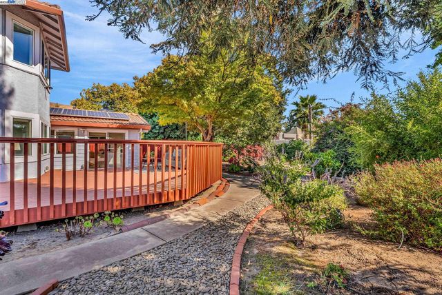 a view of house with backyard