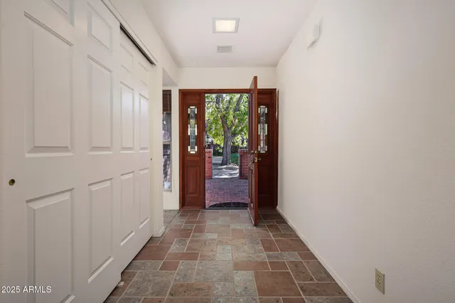 a kitchen with stainless steel appliances granite countertop a sink and a stove