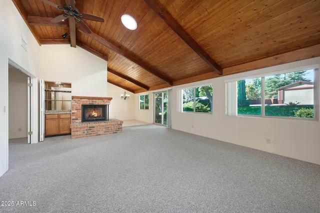 a kitchen with a sink a refrigerator and cabinets