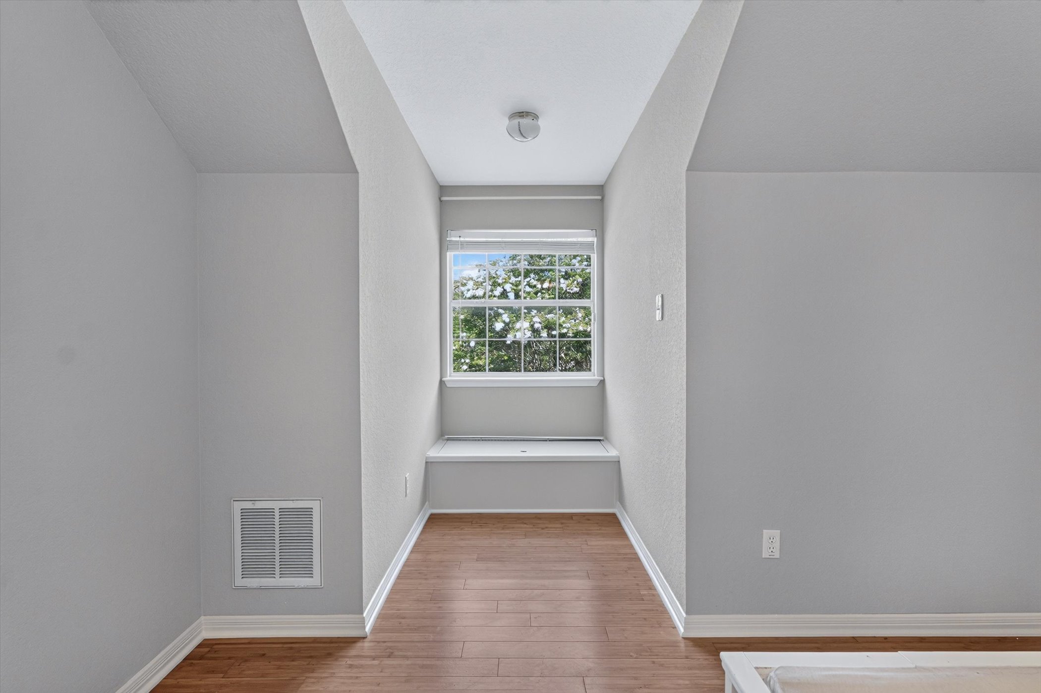 13615 Copperleaf Trail Manchaca, TX 78652 - Photo 28 of 38 Hardwood floors lead to a window seat, ideal for quiet reading.