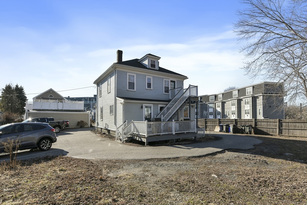 378-380 Neponset Avenue Boston, MA 02122 - Photo 12 of 33 a front view of a house with a yard