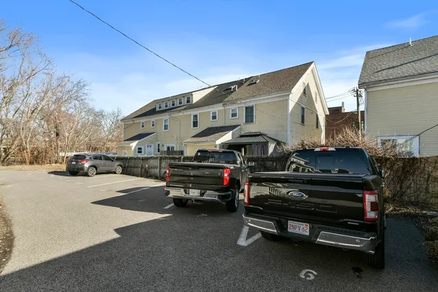 an aerial view of houses with outdoor space