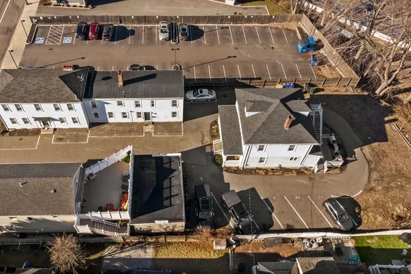 an aerial view of a building with outdoor seating