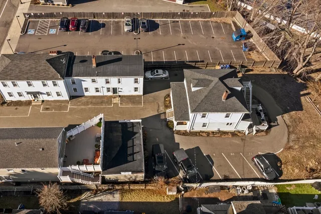 an aerial view of a building with outdoor seating