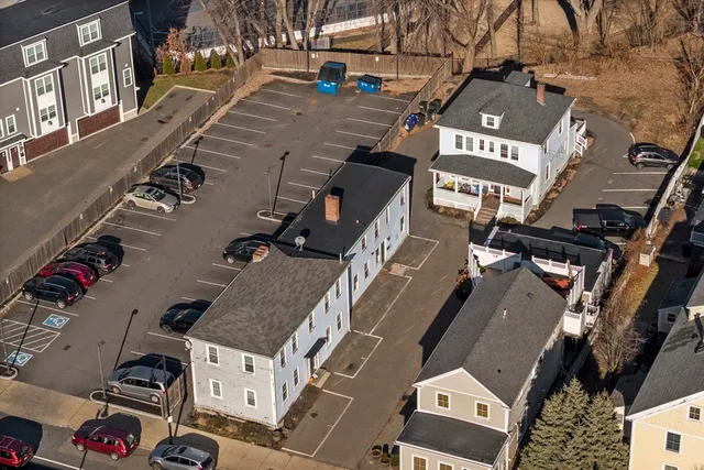 an aerial view of a house with swimming pool