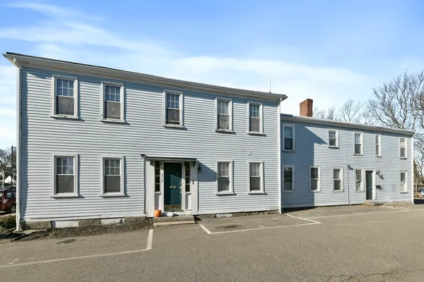 a view of a house with entrance gate