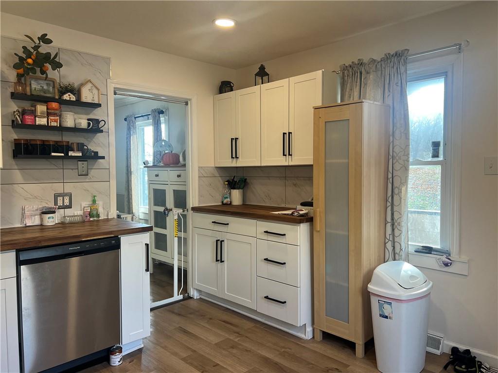 1747 Galilee Road Wampum, PA 16157 - Photo 5 of 11 a kitchen with a stove a sink and a refrigerator