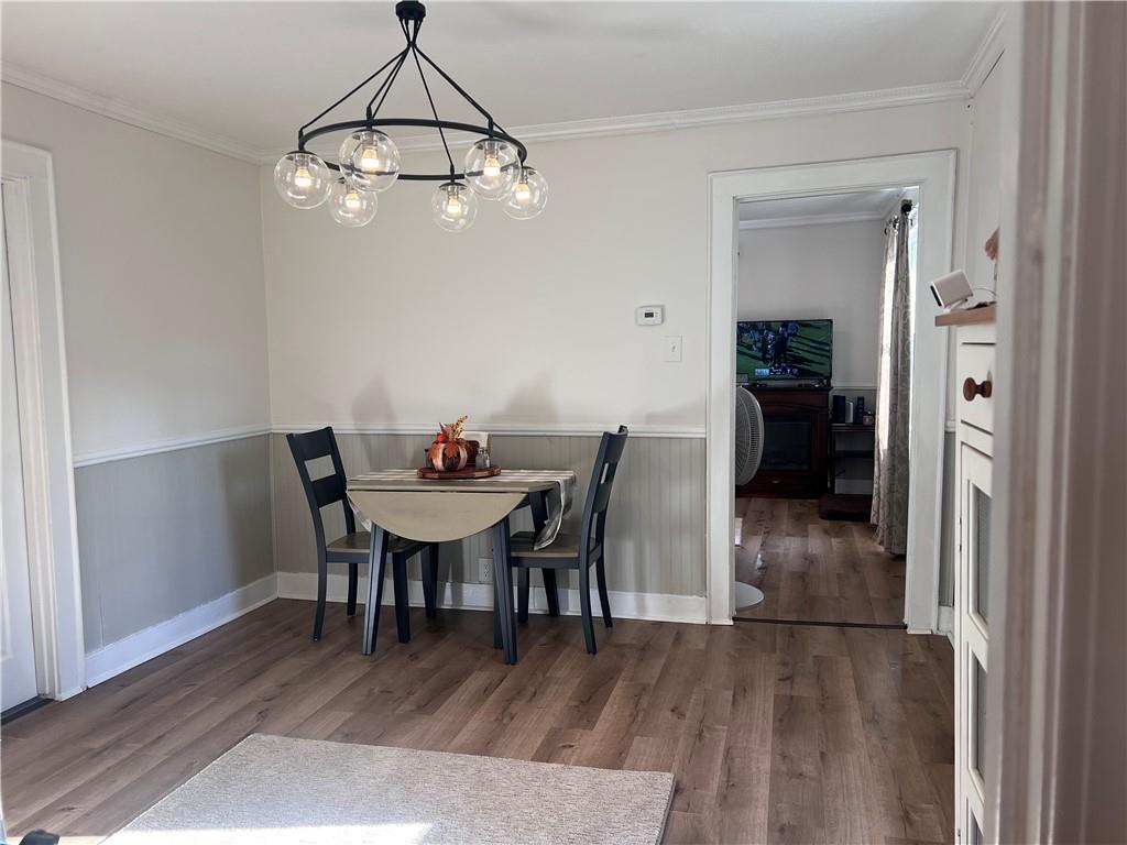 1747 Galilee Road Wampum, PA 16157 - Photo 6 of 11 a view of a dining room with furniture and wooden floor