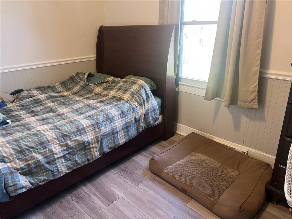 1747 Galilee Road Wampum, PA 16157 - Photo 9 of 11 a bed sitting in a bedroom next to a window