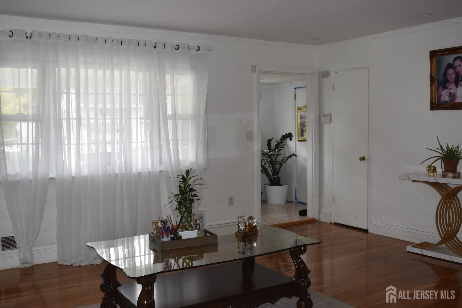 193-193 McFarlane Road Colonia, NJ 07067 - Photo 3 of 7 a dining room with furniture and wooden floor