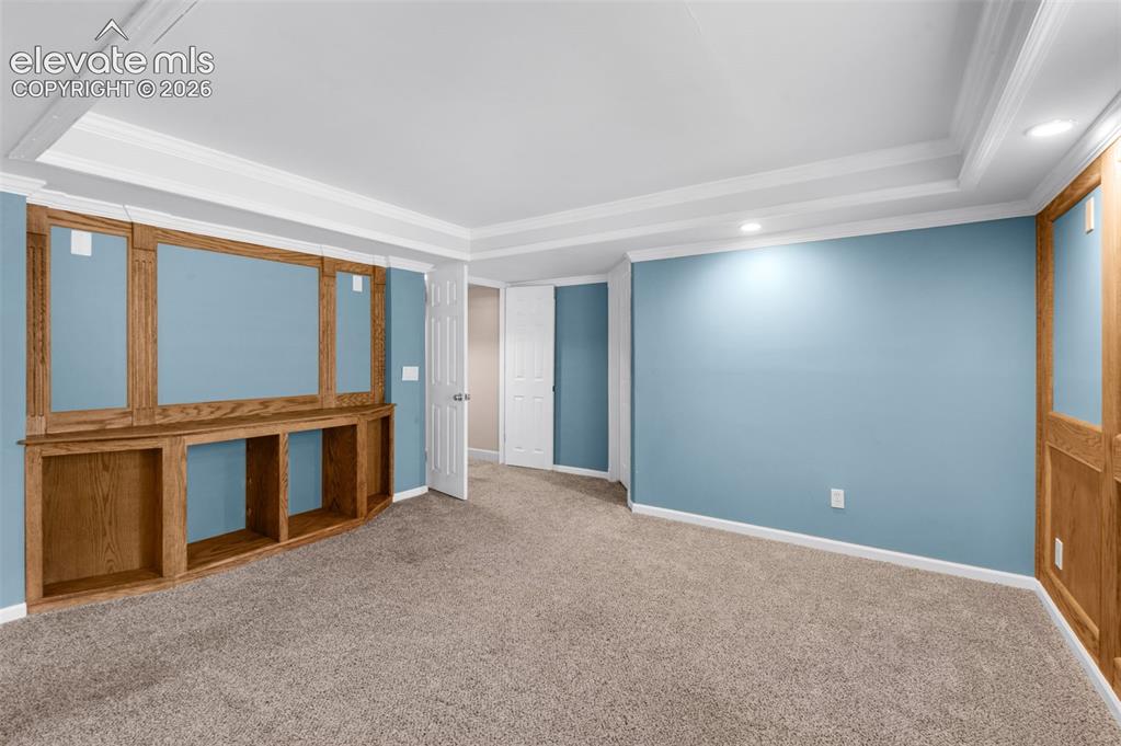 7840 Midnight Road Peyton, CO 80831 - Photo 34 of 48 Coved ceiling, crown molding and wood accents