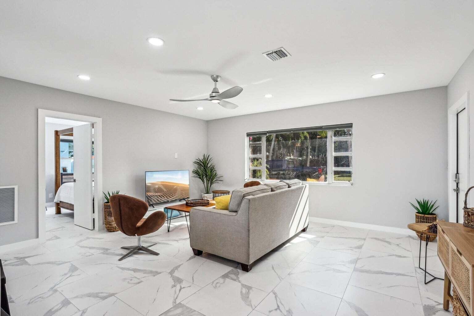 711 Southeast 2nd Street, Unit 4 Delray Beach, FL 33483 - Photo 11 of 23 a living room with furniture and window