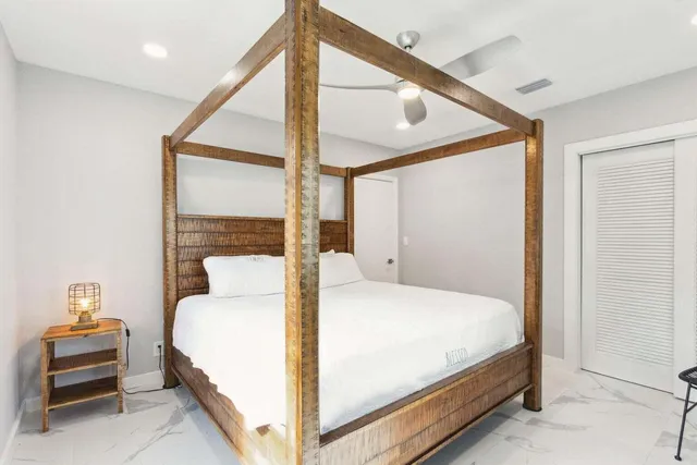 a bedroom with furniture and a window