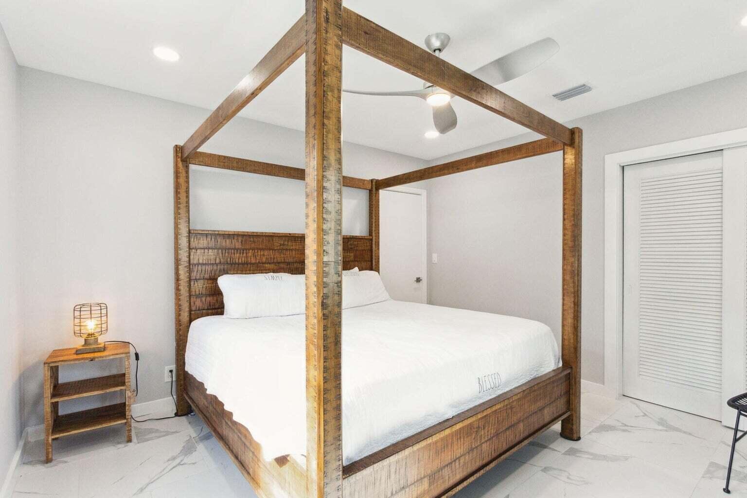 711 Southeast 2nd Street, Unit 4 Delray Beach, FL 33483 - Photo 12 of 23 a bedroom with a bed and a window