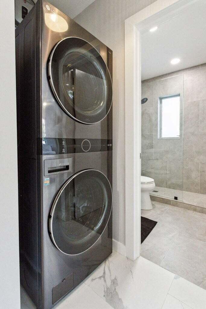 711 Southeast 2nd Street, Unit 4 Delray Beach, FL 33483 - Photo 14 of 23 a room with a washer and dryer