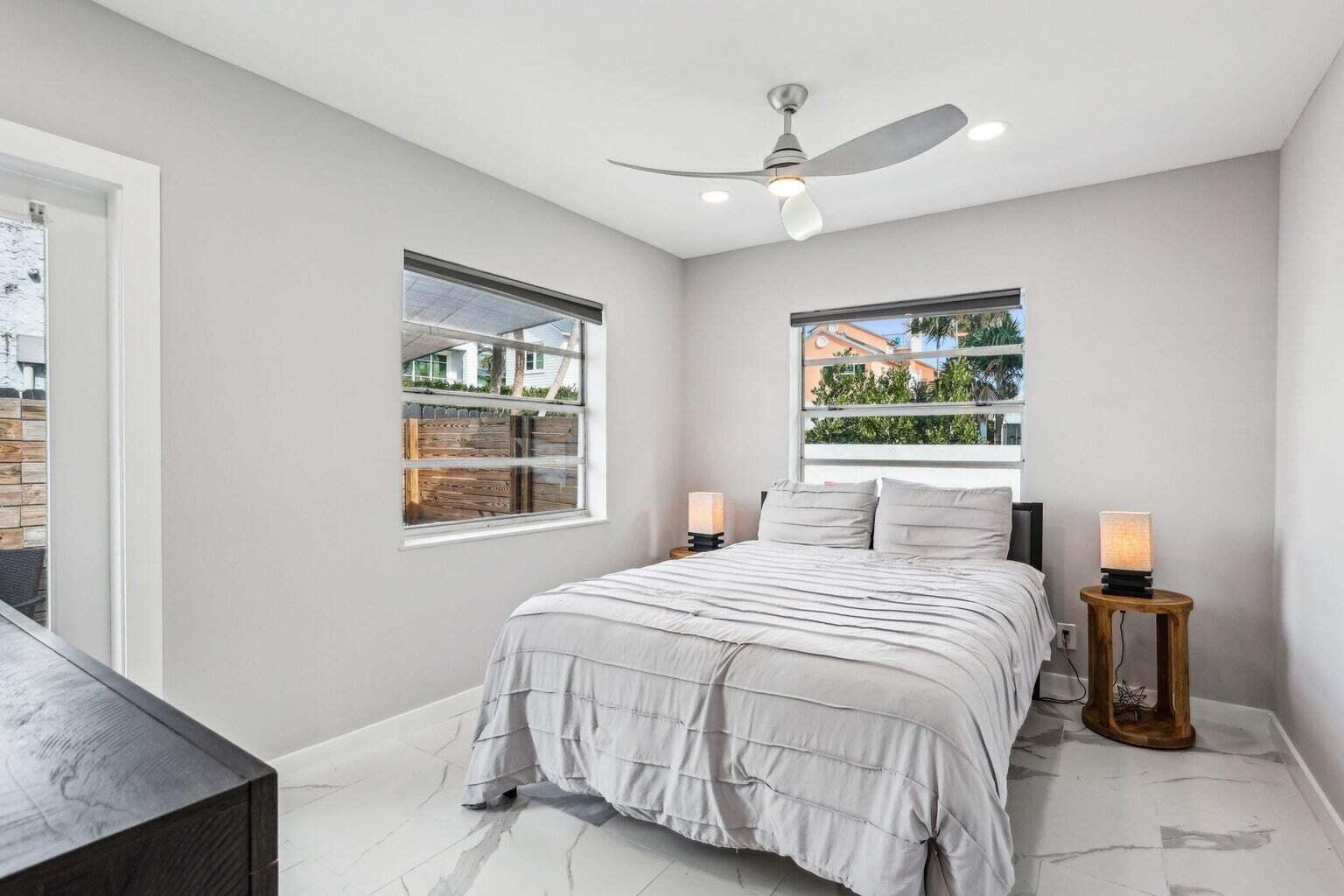 711 Southeast 2nd Street, Unit 4 Delray Beach, FL 33483 - Photo 16 of 23 a bedroom with a bed and a window