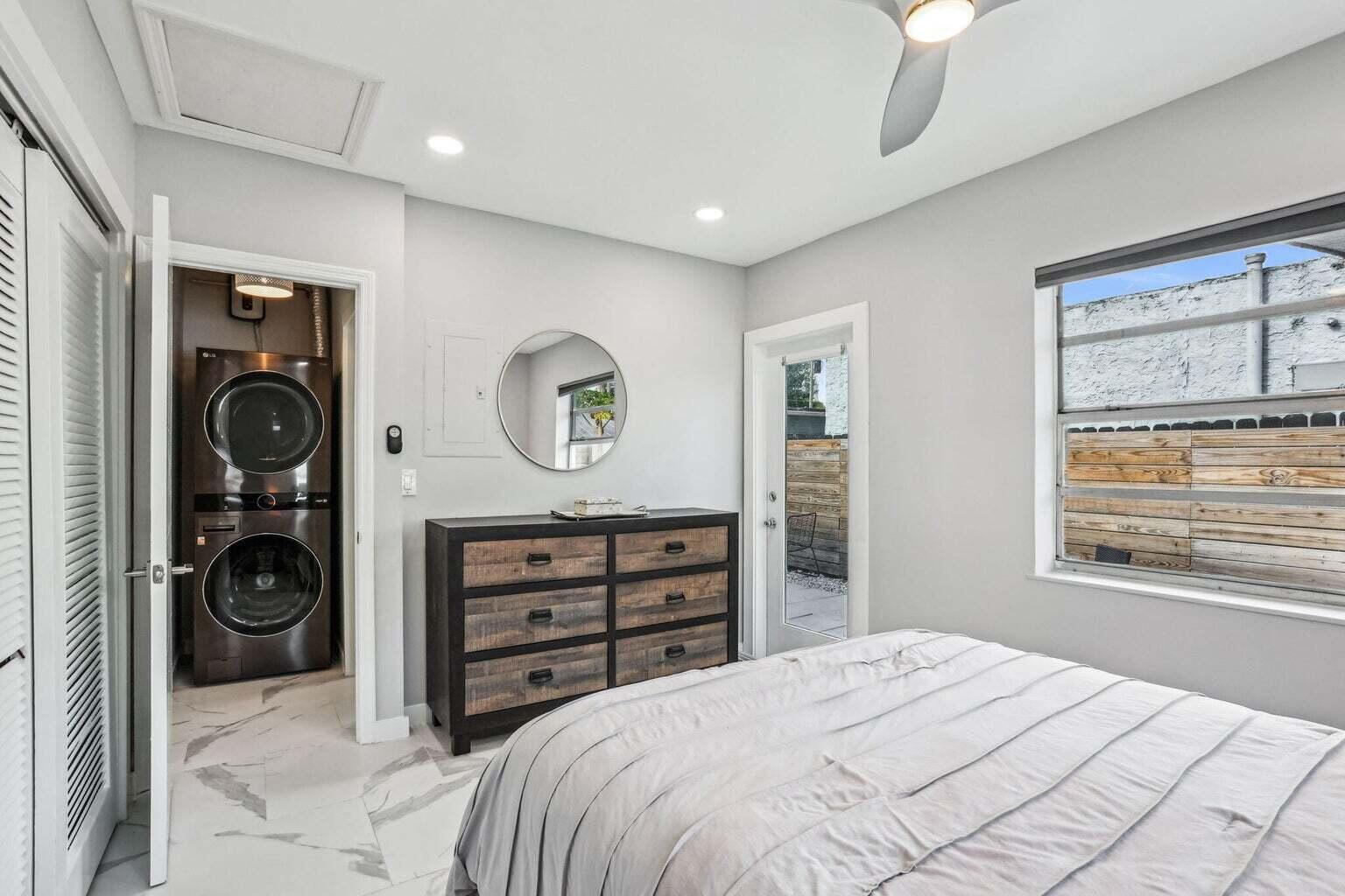 711 Southeast 2nd Street, Unit 4 Delray Beach, FL 33483 - Photo 17 of 23 a bedroom with a bed and a window