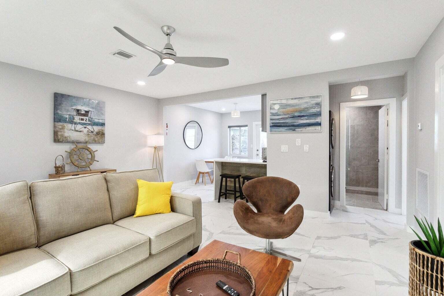 711 Southeast 2nd Street, Unit 4 Delray Beach, FL 33483 - Photo 9 of 23 a living room with furniture a rug and a window