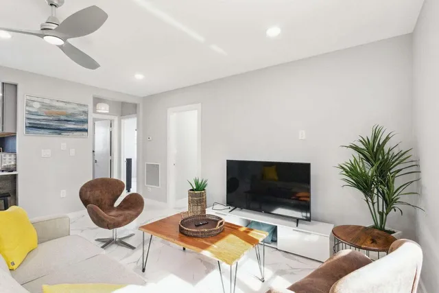 a living room with furniture and window