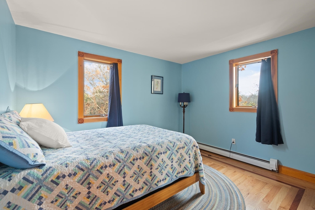 20 Calder Street Gloucester, MA 01930 - Photo 16 of 27 a bedroom with a bed and a window