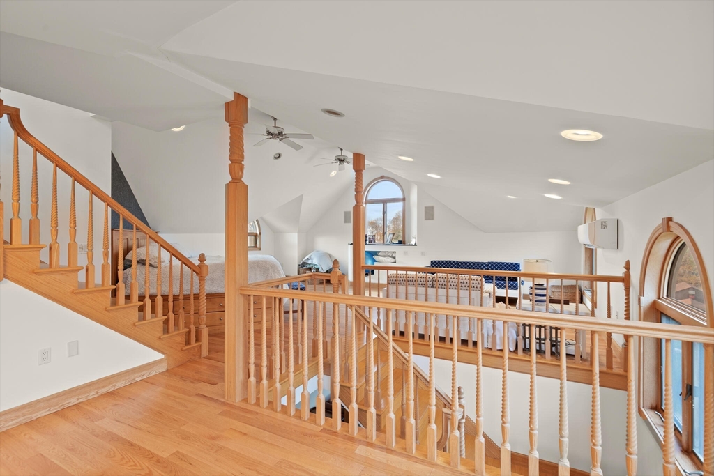 20 Calder Street Gloucester, MA 01930 - Photo 18 of 27 a view of staircase with lots of frames on wall and a large window
