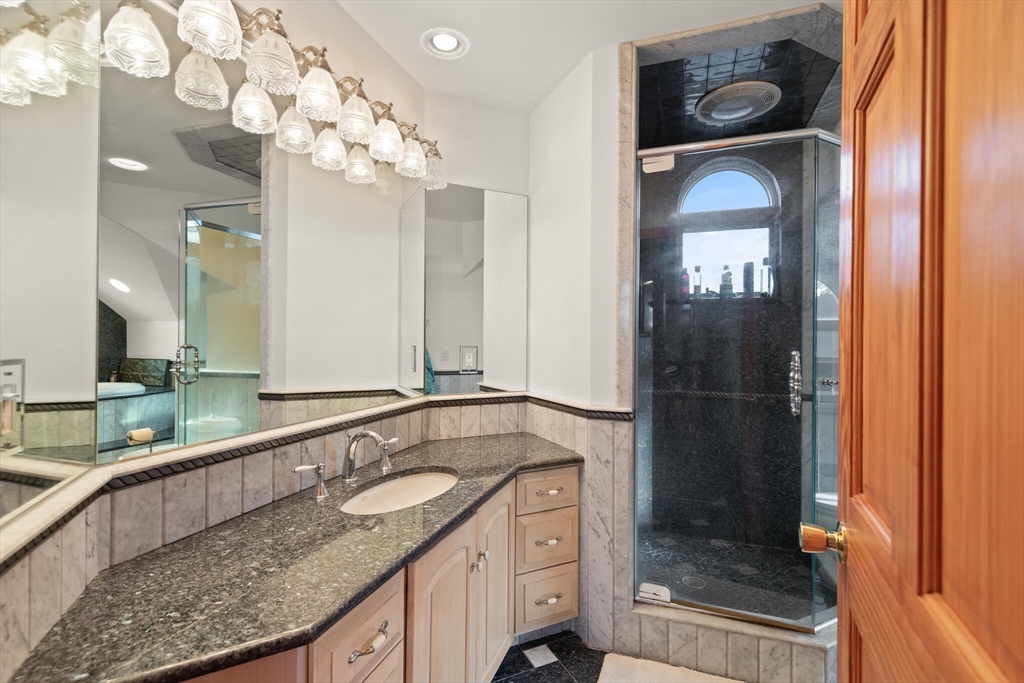 20 Calder Street Gloucester, MA 01930 - Photo 20 of 27 a bathroom with a granite countertop sink a mirror and shower