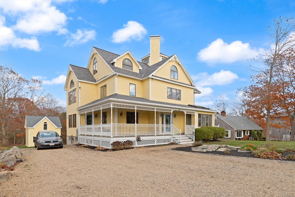 20 Calder Street Gloucester, MA 01930 - Photo 27 of 27 a view of a white house with a large windows and a yard