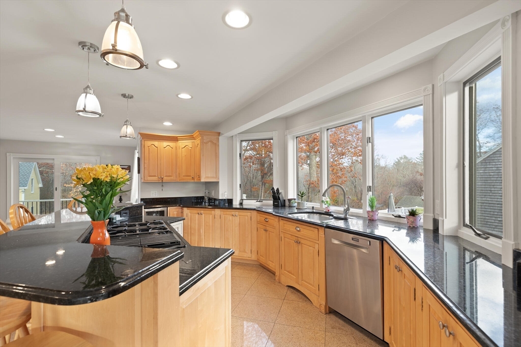 20 Calder Street Gloucester, MA 01930 - Photo 5 of 27 a kitchen with a large window cabinets and stainless steel appliances