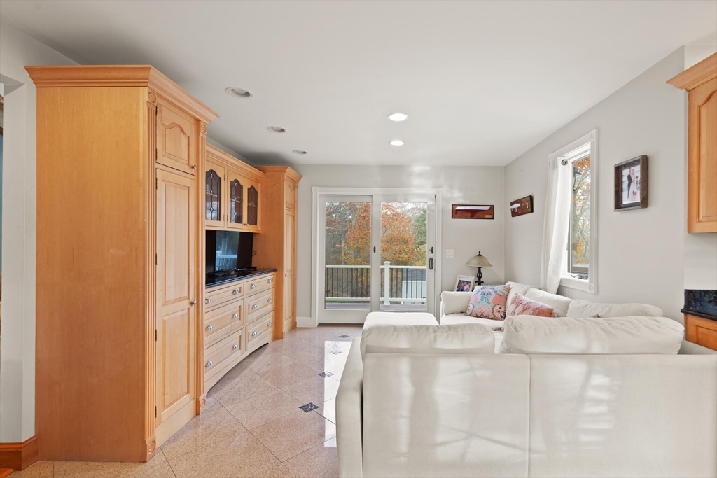 20 Calder Street Gloucester, MA 01930 - Photo 7 of 27 a bedroom with furniture and a flat screen tv