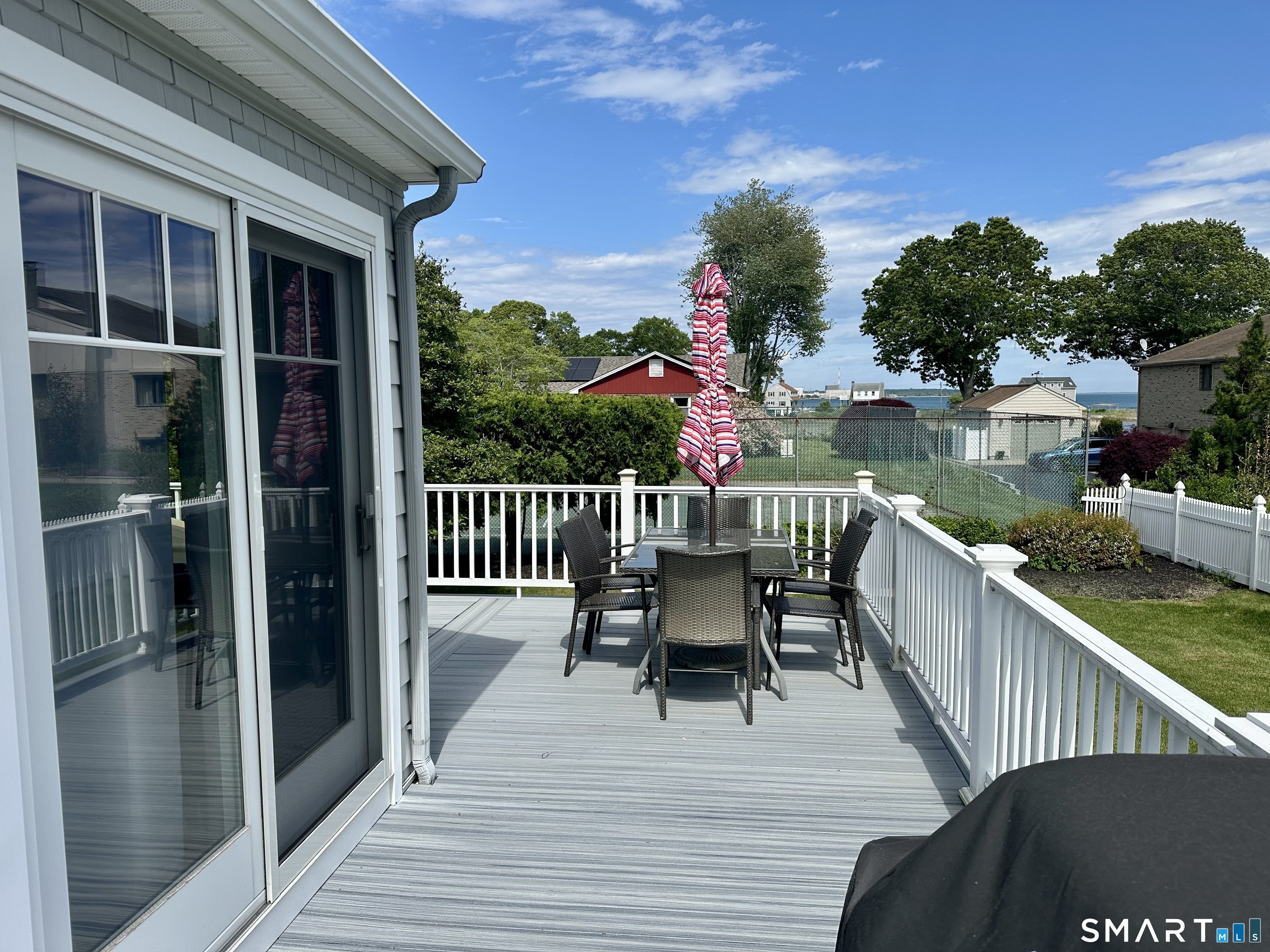 36 Attawan Road East Lyme, CT 06357 - Photo 9 of 40 Wrap around porch goes behind the Kitchen Sitting Area (See Kitchen Sliders here). Water View.