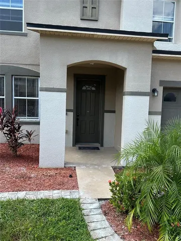 a front view of house and yard with seating space
