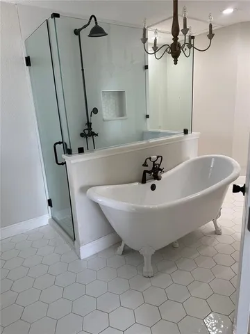 a white bath tub sitting in a bathroom