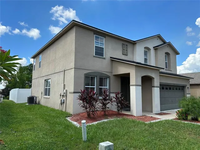 a front view of house with yard and outdoor seating